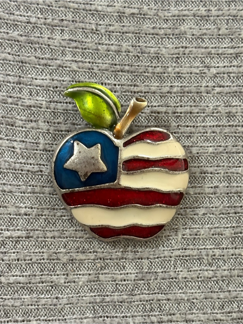 Vintage AJMC marked silver tone American flag apple brooch